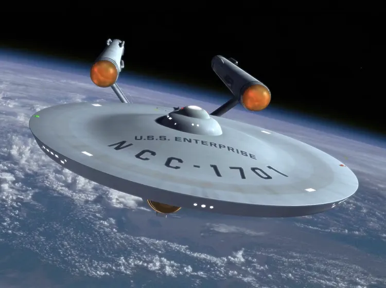 A "CBS" spacecraft floats in space above a planet, likely Earth, with visible clouds and landmasses.