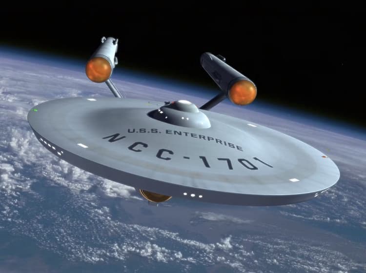 A "CBS" spacecraft floats in space above a planet, likely Earth, with visible clouds and landmasses.