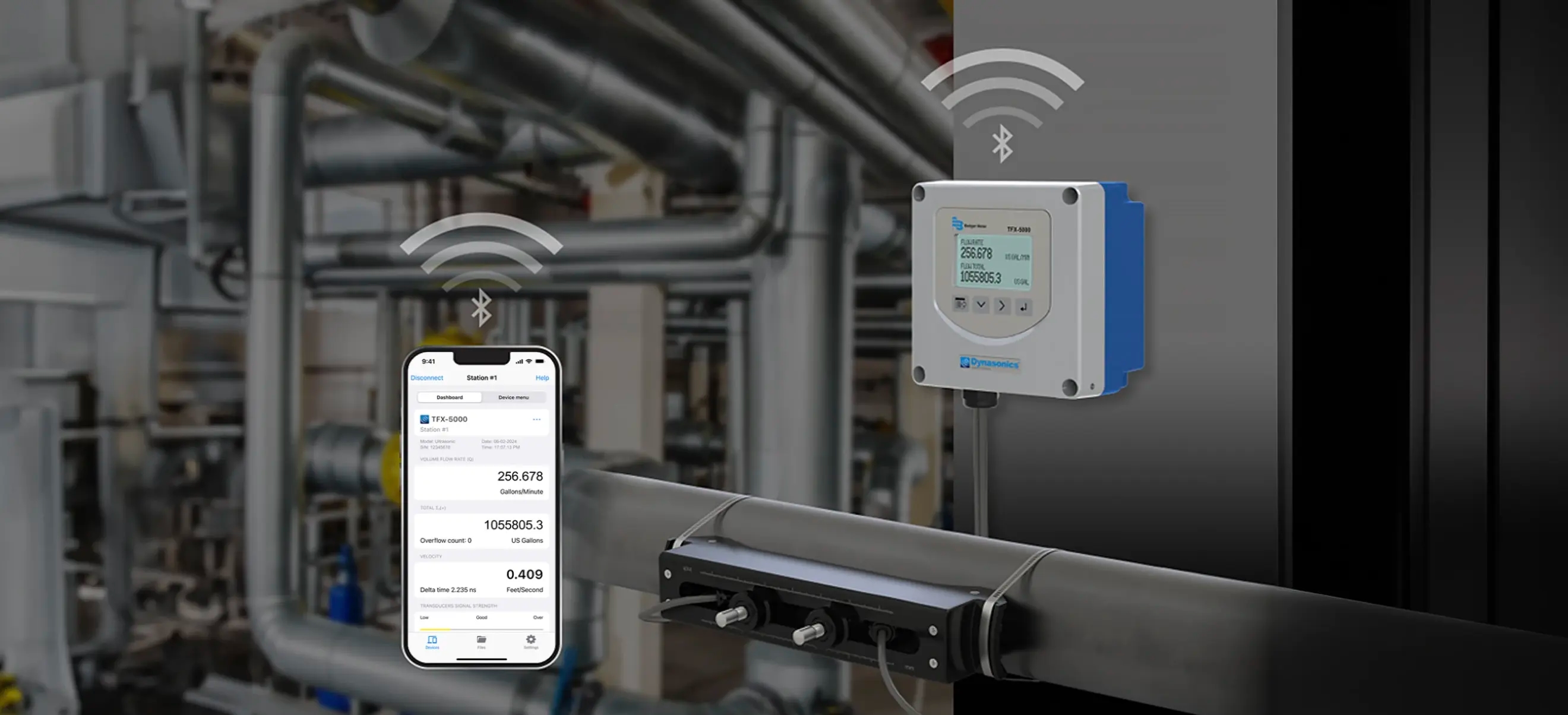 Phone screen showing the SoloCUE® Flow Device Manager app connected to an ultrasonic clamp-on flow meter in an industrial setting.