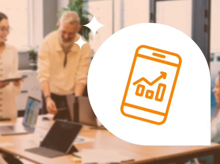 Close-up of two hands holding smartphones. The person in the foreground is using their phone with both hands, while a second person in the background, exploring opportunities to build intuitive mobile apps for their workforce, is also seen with a phone.