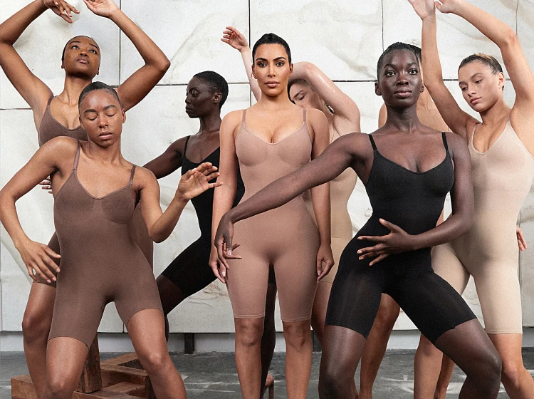 A group of women with diverse skin tones wearing various styles of shapewear