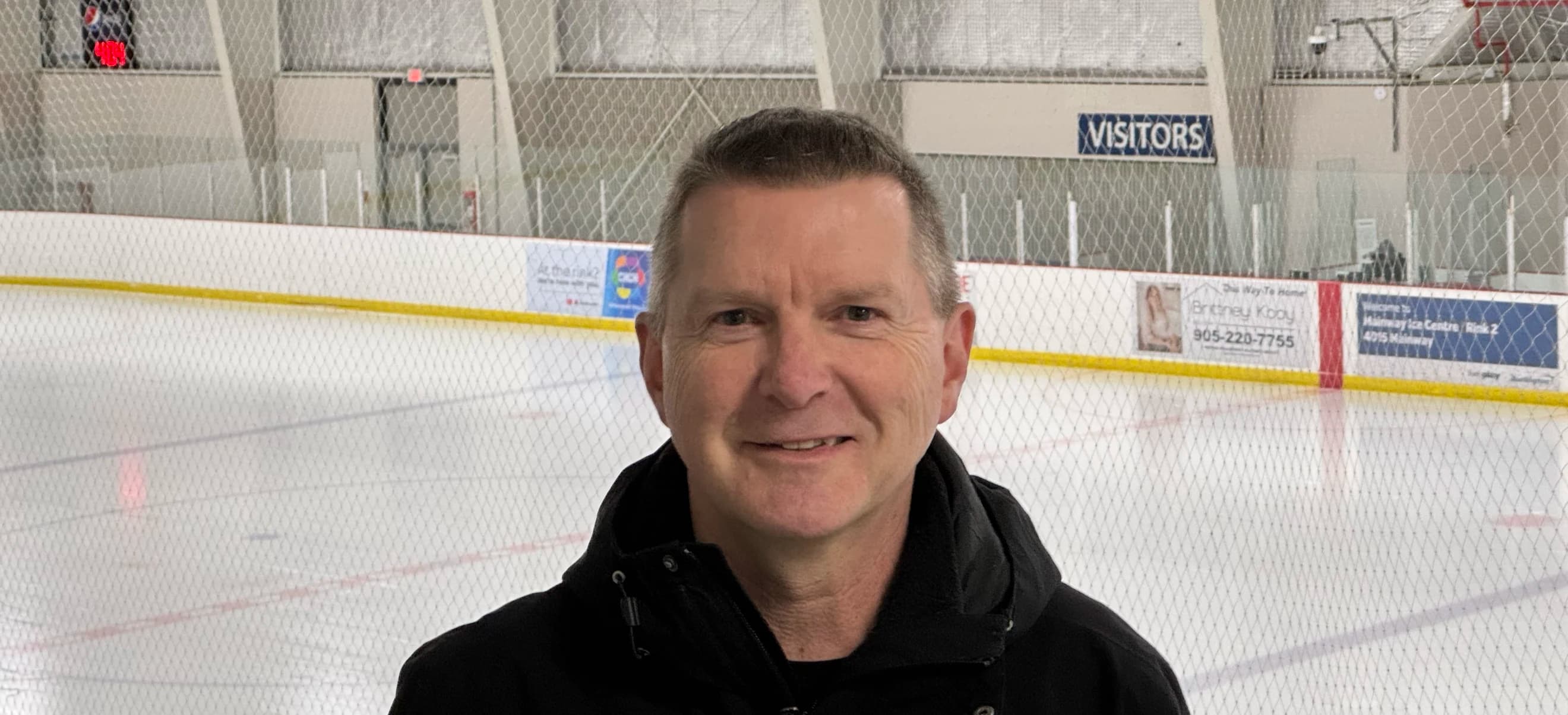 Photo of James in an ice hockey rink