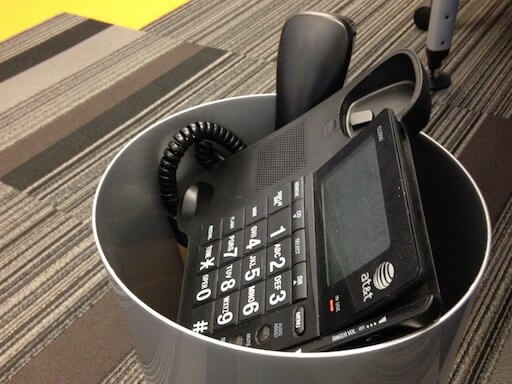 Office Phone In Trash Can