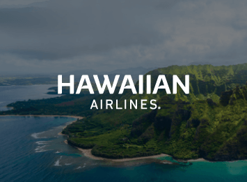 White Hawaiian Airlines logo over Hawaii coastline
