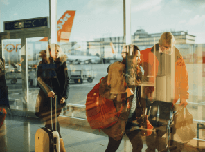 Travelers walking through an airport