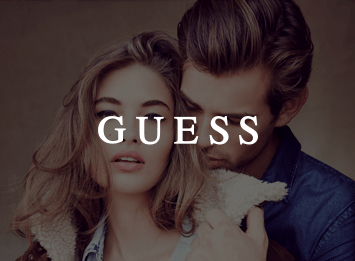 White GUESS logo and a man and woman